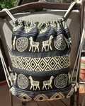 Drawstring backpack-style bag, handwoven in native Andean style with llama motifs.