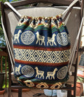 Drawstring backpack-style bag, handwoven in native Andean style with llama motifs.