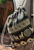Drawstring backpack-style bag, handwoven in native Andean style with llama motifs.